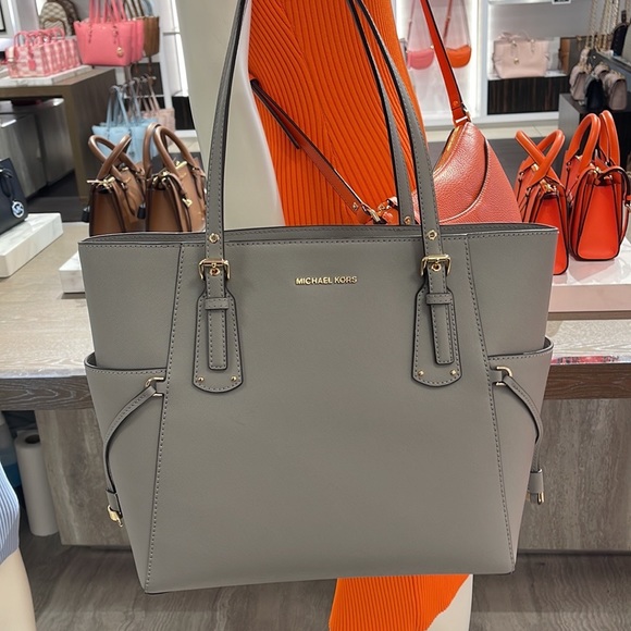 Voyager Small Saffiano Leather Tote Bag
Style# 30H1GV6T4T
NWT
COLOR: Pearl Gray - Picture 5 of 16